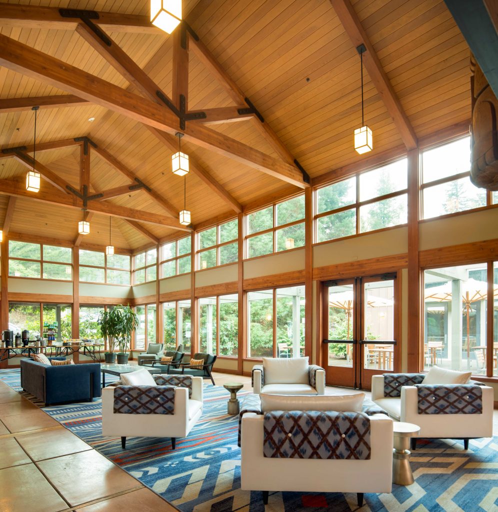 great room seating area in Skamania Lodge with white chairs and sofas in foreground