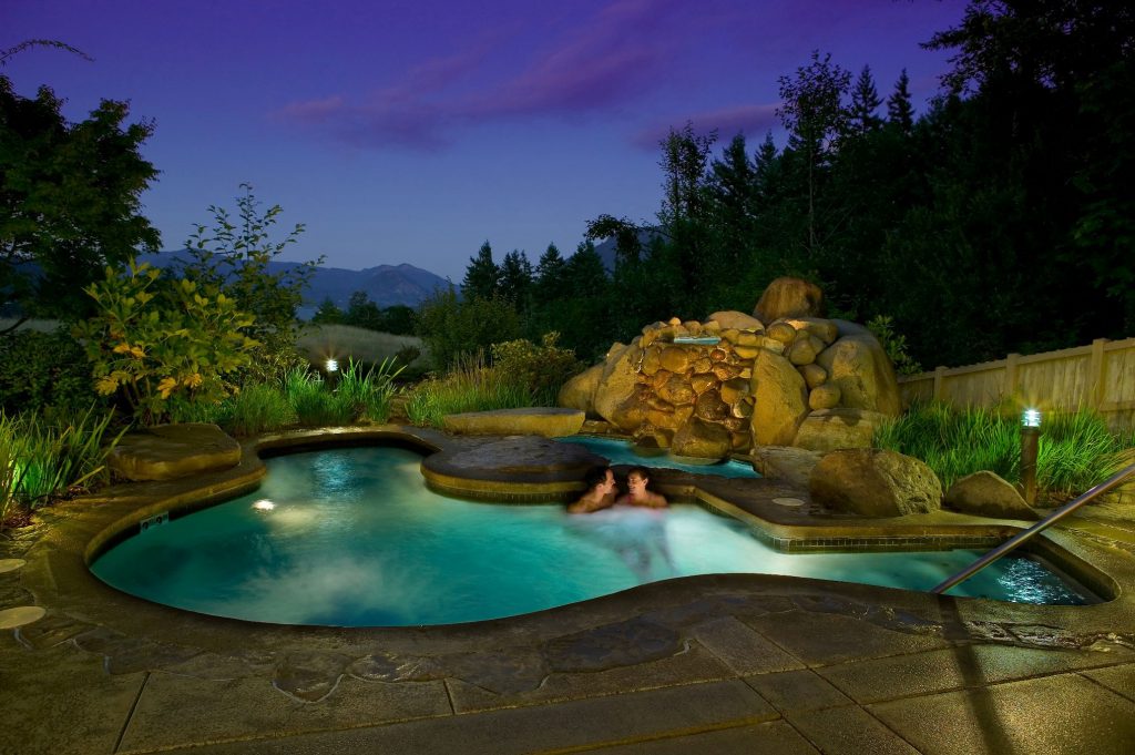 two people sitting in outdoor jacuzzi at Skamania Lodge